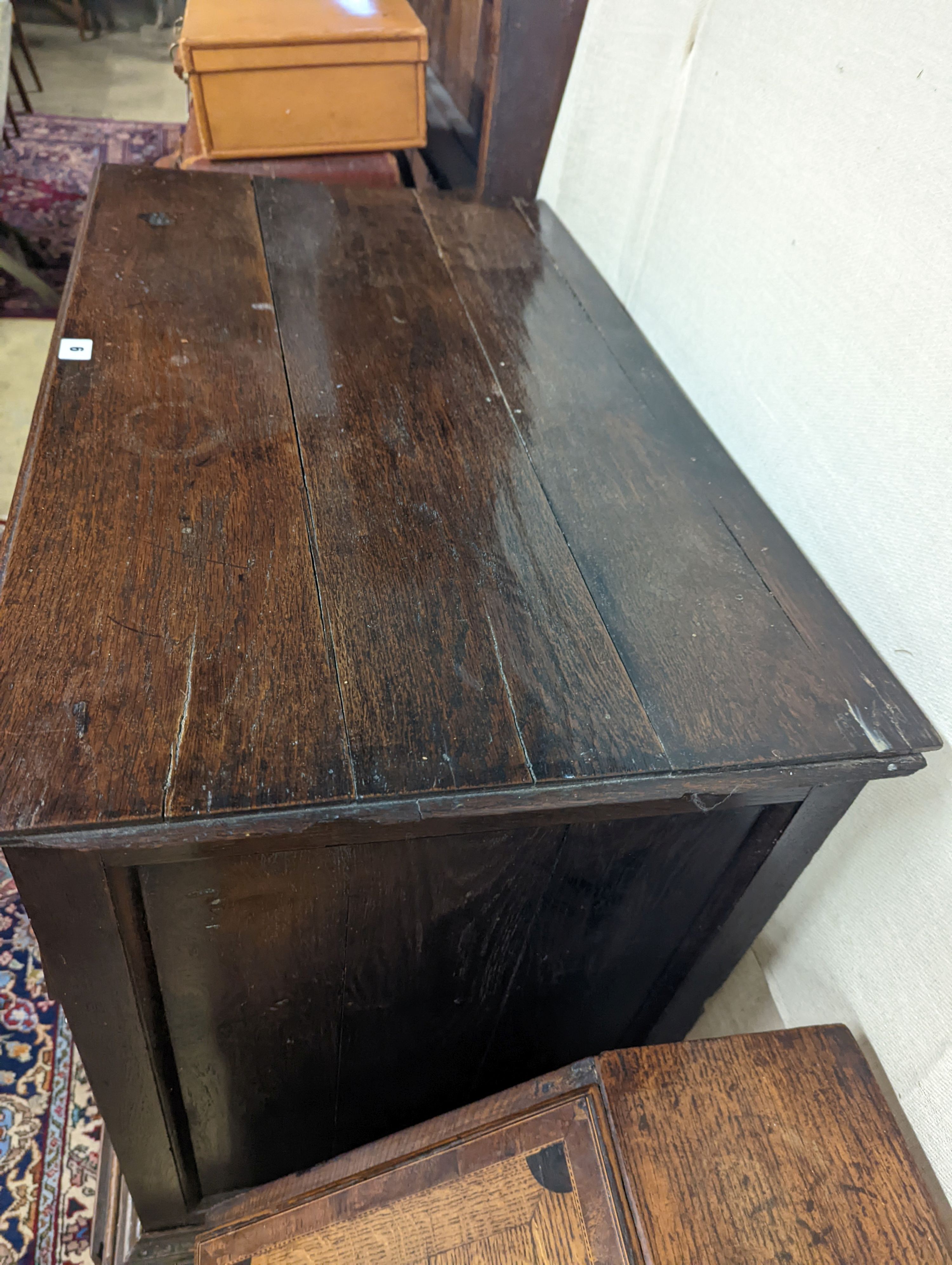 A mid 18th century oak chest on stand, width 89cm, depth 52cm, height 126cm